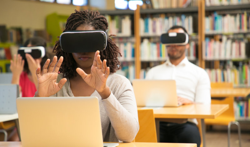 young lady learning with VR goggles 